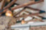 a rustic wood beam ceiling, with stone wall accents creating a cozy atmosphere in a modern interior design