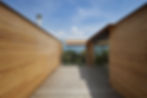 Wood architecture with slatted walls demonstrating biophilic design