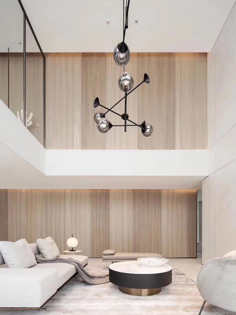 luxury home interior featuring wooden slat wall panel with warm natural tones