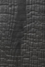 carbonized wood / charcoal burnt wood